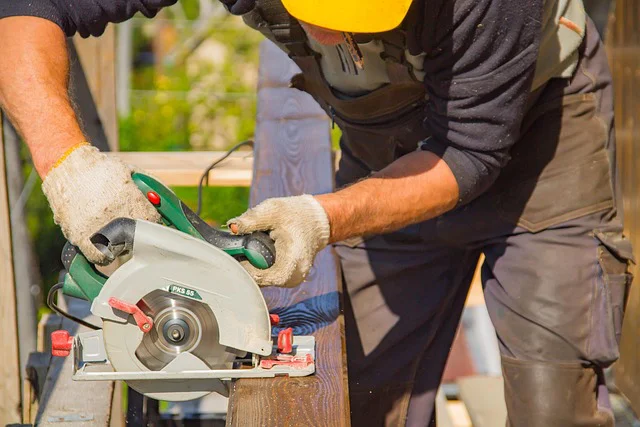builder cutting wood